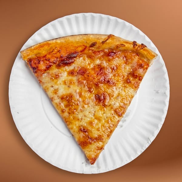 A single slice of cheese pizza with a golden crust on a white paper plate.