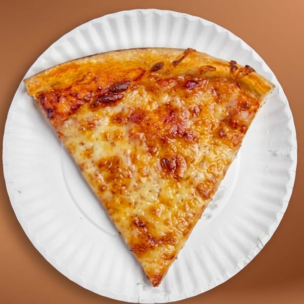 A single slice of cheese pizza with a golden crust on a white paper plate.
